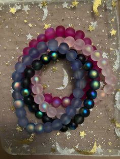 A glass beaded bracelet. Comes in hot pink, light pint, black, and blue. Glass Bracelet Ideas, Hot Pink Bracelet, Hot Pink Bracelets, Glass Beaded Bracelet, Glass Beaded Bracelets, Pink Bracelet, Pink Light, In Hot, Bracelet Designs