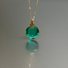 14K Gold Colombian Emerald  Necklace,  Oval Pendant, May Birthstone, Green Stone Necklace, Layering Necklace, Handmade By NAMATAdesigns. Stunning Colombian emerald necklace showcasing an oval-shaped faceted pendant with pristine clarity, radiating a mesmerizing ocean-green hue. The exquisite pendant, which beautifully reflects light, is affixed to bail and hangs delicately from a chain available in 14K Gold Fill, Sterling Silver, or Rose Gold Filled chain. The necklace exudes elegance, offering Green Stone Necklace, Ocean Green, Necklace Layering, Solid Gold Chains, Gold Fashion Necklace, Emerald Pendant, Colombian Emeralds, May Birthstone, Emerald Necklace