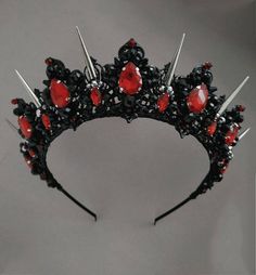 Crowns from the Exclusive Wedding Shop are always: * unique author's design * stunning detail * 100% handiwork * light weight for comfortable wearing * quality materials * large assortment for any occasion Luxurious black and red tiara. Made of black light metal and crystal and beads. This design of a black crystal tiara will ideally look like a wedding crown, a crown for an adult birthday, for a party of Heloween, for a Goth wedding. The crown height in the center is about 2 inches. Earrings le Persephone Crown, Black Halo Crown, Evil Queen Crown, Gothic Tiara, Red Tiara, Prom Tiaras, Dark Wedding Theme, Black Tiara, Gothic Crown