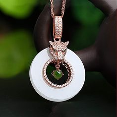 * INTRODUCTION----- This pendant is made with high-quality genuine nephrite white and green jade. It looks so luxurious and exquisite. The jade looks so clean and smooth. The round white jade has the meaning of luck and prosperity. The green round jade bead in the middle and the zircon Leopard head makes the pendant is so fashionable and nice. The style is cute and unique. And The jade is always the meaning of luck. It's a perfect gift for your love. Specifications: Approx. Product dimension: 25 Leopard Necklace, Sapphire Diamond Pendant, Leopard Head, Gifts For Your Sister, Nephrite Jade, Jade Necklace, White Jade, Jade Jewelry, Traditional Jewelry