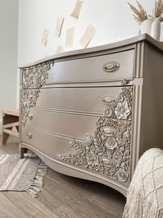 an ornate dresser is shown with many papers on it