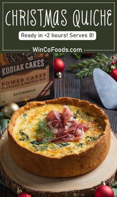 christmas quiche ready in 24 hours served on a wooden platter with holiday baubies around it