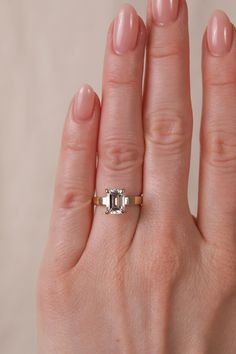 a woman's hand with a ring on it