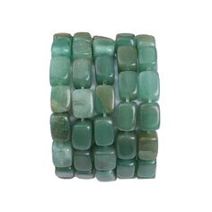 several pieces of green jade beads are stacked together on top of each other in rows