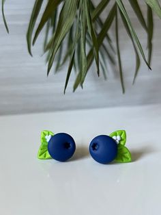 Cute blueberry stud earrings. Carefully handcrafted using polymer clay and 18k gold plated stainless steel studs. Perk up your outfits with these fun accents. Lightweight and easy to wear. Please note that these are handmade items, and thus slight variations may occur compared to the listed photos. There may be small imperfections, such as very small air bubbles or tiny specks of lint.  How to take care of your earrings - do not wear when you swim or shower, do not expose to perfumes, oils, chlo Cute Blue Polymer Clay Jewelry, Blueberry Clay Earrings, Blueberry Clay Magnet, Studs Polymer Clay, Blueberry Jewelry, Small Clay Earrings Stud, Cute Blue Polymer Clay Earrings, Cute Blueberry, Polymer Clay Studs