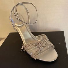 Marc Fisher Canellie Heel Sandal, Silver With Bow, Size 9.5 (New). This Sleek And Chic Sandal By Marc Fisher Ltd Canellie Dress Sandal Features A Solid Yet Polished Silhouette. Paired With A Tapered Heel, Padded Footbed And Embellished Upper. Heel Height: 3.94"" This Is A Cute Pair Of Sandals. Glamorous Wedding Shoes With Removable Insole, Cocktail Sandals With 4-inch Heel, Synthetic Open Heel Wedding Shoes, Formal Synthetic Wedding Shoes With Open Heel, Synthetic Round Toe Sandals For Events, Event Synthetic Sandals With Round Toe, Event-ready Round Toe Synthetic Sandals, Formal Open Toe Synthetic Wedding Shoes, Synthetic Sandals For Wedding