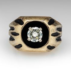 an antique diamond and black enamel ring