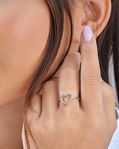 Simple and sweet, this open heart ring is a perfect gift for any special woman in your life! The delicate band has a chic heart-shaped design. Available in gold and silver tones. Materials: 14K gold plated sterling silver or sterling silver Features: 1.5mm band, 0.45" heart, Lead & Nickel free, open band- allows for minor adjustments Elegant Heart Ring With Open Band, Elegant Open Band Heart Ring Gift, Elegant Open Band Heart Ring, Delicate Sterling Silver Heart Ring, Delicate Silver Heart Promise Ring, Minimalist Heart Cut Stackable Rings, Elegant Stackable Rings For Valentine's Day, Dainty White Gold Heart Ring For Promise, Dainty White Gold Heart Promise Ring