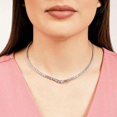 This diamond necklace offers a modern spin to the classic tennis necklace design. It has a sleek ribbon of graduating diamonds on a four-prong setting lining its center. Shiny metal links make up the two ends of the diamond row. Modern Diamond Cut Diamond Necklace For Formal Events, Timeless Diamond Tennis Necklace For Formal Occasions, Modern Diamond White Diamond Necklace For Formal Occasions, Modern Brilliant Cut Diamond Necklace For Formal Occasions, Everyday Luxury Diamond Jewelry With Tension Setting, Elegant Round Cut Tennis Necklace For Anniversary, Elegant Anniversary Tennis Necklace With Brilliant Cut, Elegant Round Cut Tennis Necklace For Everyday Luxury, Formal White Gold Tennis Necklace With Diamond Accents