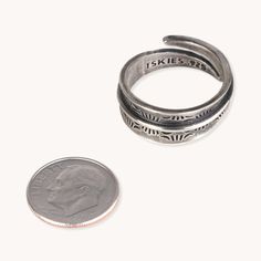 The Stamp Dancer: Carpenter Adjustable Ring is a great option for any stylish jewelry enthusiast. Crafted from ethically-sourced sterling silver, the handmade ring is adjustable for the perfect fit. Add a touch of sophistication to your look with this unique wrap ring. Sterling Silver Adjustable Ring 3/8" Width Rustic Patina Finish Adjustable Stackable Bypass Ring As A Gift, Adjustable Stackable Bypass Ring For Promise, Adjustable Open Bypass Ring For Promise, Adjustable Open Bypass Promise Ring, Adjustable Sterling Silver Engraved Ring, Nickel Free, Adjustable Nickel-free Sterling Silver Engraved Ring, Adjustable Nickel Free Sterling Silver Engraved Ring, Adjustable Open Bypass Ring As Gift, Adjustable Stackable Open Engraved Ring