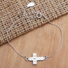 Shining brightly, this cross bracelet is a beautiful way to express your Christian faith. Asmara Putra in Bali designs the pendant bracelet, which is crafted from sterling silver. Silver Cross Bracelet, Spiritual Style, Silver Bracelet With Cross Pendant As Gift, Spiritual Silver Cross Bracelet, Sterling Silver Spiritual Rosary Bracelet With Cross, Sterling Silver Cross Rosary Bracelet, Spiritual Sterling Silver Cross Rosary Bracelet, Silver Cross Rosary Bracelet, Amethyst Cocktail Ring, Large Bracelet