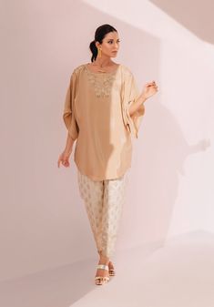 SKU: 3002 Price for Shirt & Trouser 2pc This stellar piece consist of soft creoe silk with delightful cutwork details. Paired with a embroidered pants with thread and sequins details- giving it a modernly grace. Chic Embroidered Festive Sets, Elegant Floral Embroidery Pant Set For Festive Occasions, Chic Festive Sets With Floral Embroidery, Chic Silk Sets With Floral Embroidery, Chic Festive Sets With Resham Embroidery, Silk Wedding Sets With Set-in Sleeves, Elegant Chikankari Embroidery Sets With Straight Pants, Chic Silk Set For Festive Occasions, Chic Festive Eid Sets