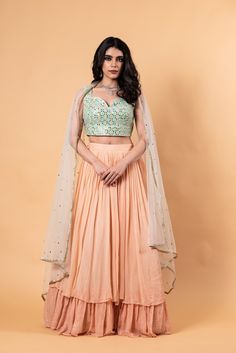 Peach Lehenga Set with Mirror Work Choli and Dupatta - Anvi Couture Peach Wedding Sets With Sheer Dupatta, Peach Georgette Sets With Zari Work, Traditional Peach Lehenga With Sheer Dupatta, Peach Choli With Sheer Dupatta For Reception, Peach Dupatta Set For Reception, Peach Semi-stitched Floor-length Sharara, Peach Color Sets With Dupatta For Reception, Floor-length Peach Sharara, Peach Wedding Sets With Resham Embroidery