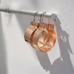 Transform your look with our Luxe - Hammered Copper Hoops. These stunning, handcrafted earrings feature an intricate hammered design and a radiant shine. Elevate your style with these unique and luxurious accessories. They hang approximately 1.75 inches from the top of the earwire. Sent in a lovely ribboned gift box with a polishing cloth Luxurious Accessories, Open Hoop Earrings, Hammered Metal, Large Hoop Earrings, Hammered Copper, Handcrafted Earrings, Delicate Earrings, Stunning Earrings, Copper Earrings