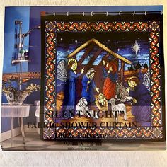 a stained glass nativity scene with the birth of jesus and baby jesus on it