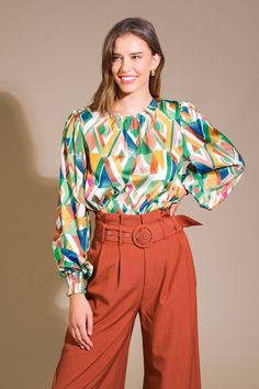 A printed woven top featuring round neckline, blouson sleeve with smocked cuff and back neck button closure Details: Self : 100% Polyester Size & Fit - Model is 5`8" And Wearing Size Small- Measurements Taken From Size Small- Approx. Length: 23" Chic Multicolor Print Blouse For Fall, Chic Multicolor Print Fall Blouse, Trendy Multicolor Top With Smocked Back, Multicolor Print Tops For Workwear In Fall, Multicolor Print Tops For Fall Workwear, Trendy Multicolor Tops With Smocked Back, Multicolor Print Tops For Workwear And Fall, Multicolor Puff Sleeve Blouse For Fall, Multicolor Puff Sleeve Top For Fall