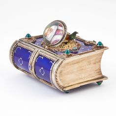 At Auction: Karl Griesbaum Sterling Silver Gilt, Enamel & Hardstone Mounted Book-Form Singing Bird Box Second quarter 20th century Automata Mechanical, Bird Box, Singing Bird, Tsar Nicholas Ii, Tsar Nicholas, Bird Boxes, Historical Novels, Music Boxes, Music Box