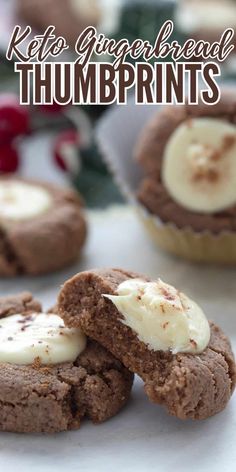 chocolate cookies with white frosting and bananas on top are sitting next to each other in front of the words, keto gingerbread thumbprints