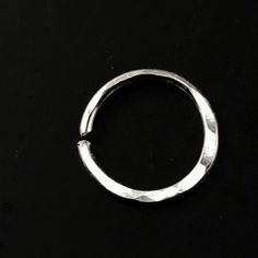 18 gauge Septum Ring / Nose Ring / Cartilage Ring - made from sterling silver - all ends are rounded / de-burred / polished - 10mm across or choose an alternate size - nickel free - measurement are INNER diameter - you open these to the side so as to retain the circle shape - this ring has a flattened lower edge that has been hammered - these are sold as singles My catchless endless rings are handmade by me with hard temper wire to ensure they retain their shape. Polished and rounded earring end Round Metal Cartilage Earrings As Gift, Round Metal Cartilage Earrings For Gift, Silver Minimalist Septum Ring For Everyday, Minimalist Silver Septum Ring For Everyday, Nickel-free Silver Hoop Rings, Silver Hoop Rings For Gifts, Everyday Minimalist Silver Septum Ring, Nickel Free Metal Septum Ring As Gift, Nickel-free Metal Septum Ring As Gift