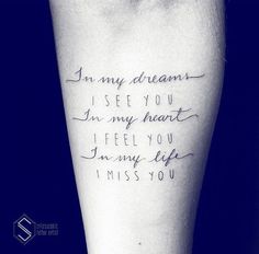 a person with a tattoo on their arm saying i am my dreams is see you in my heart