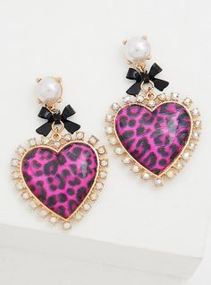 Take a walk on the wild side with these statement earrings featuring pink leopard hearts. A bold, limited-edition collection that combines the pretty-meets-punk aesthetic of Betsey Johnson with Torrid’s. Post backs. Base metal. Imported. The best plus size women's betsey johnson pink leopard heart statement earrings in multi. Torrid is your destination for the freshest spring and summer styles. Torrid is your destination for plus size Betseyj merchandise. Trendy Heart Earrings For Valentine's Day, Trendy Party Heart Earrings With Heart Charm, Trendy Heart Print Earrings For Party, Trendy Heart Print Earrings For Valentine's Day, Trendy Party Heart Earrings, Trendy Heart Earrings For Party, Trendy Valentine's Day Party Earrings, Pink Heart Earrings For Party, Trendy Pink Heart Charm Earrings