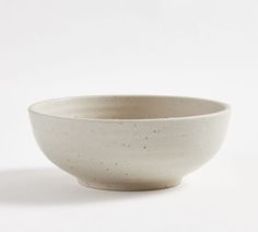 a white bowl sitting on top of a table