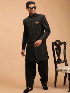 VASTRAMAY Men's Black Sherwani Set Make a statement with this elegant black sherwani set from VASTRAMAY. Perfect for special occasions, this set features intricate embroidery and a classic design that exudes sophistication. Features: Intricate embroidery Classic design High-quality fabric Comfortable fit Specifications: Color: Black Material: Silk Blend Sleeve Type: Long Sleeves Neck: Mandarin Collar Closure: Buttoned Placket Material & Care: Shell: Silk blend; Lining: Polyester Dry-clean only L Black Sherwani, Intricate Embroidery, Mandarin Collar, Sleeve Type, Outfit Sets, Classic Design, Quality Fabric, Types Of Sleeves, Special Occasion