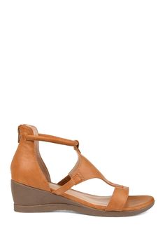 This sandal style wedge is the perfect new addition to your summer closet. The Trayle wedge by Journee Collection features an open toe design and a rubber wedge. The faux leather and caged design adds a sense of high-class. The ring ankle strap completes the unique design. 2" heel Open toe Zip closure Wedge heel Synthetic upper, rubber sole Imported Wide Width Sandals, Heel Grips, Summer Closet, Strap Wedge, Journee Collection, Sandal Fashion, Toe Designs, Wedge Sandal, T Strap