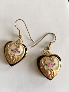 "Simply beautifully retro and classic These pretty earrings would make the perfect gift for a birthday present, Mother's Day gift or Graduation present, Valentines Day.... or just because. These hand enameled lavender and cream vintage enamel earrings are hand painted with pink rosettes and green leaves. The hearts are washed in 14K gold and are accented with complimentary antique Czech glass beads The earrings open and close securely to hold a secret treasure and measure 3/4 \" x 3/4\" . They d Vintage Silver Heart Earrings, Vintage Earrings Victorian, Locket Earrings, Graduation Present, Silver Heart Earrings, Deep Winter, Jewelry Outfit, Enamel Earrings, Heart Locket