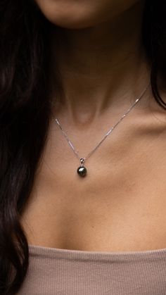 Wear the Tahitian Black Pearl Pendant in White Gold for some elegant tropical flare. The pearl hangs for the sleek white gold bail and dangles for a touch of playfulness. Locally made in Hawaiʻi. Black Pearl Pendant, Black Pearls, Tahitian Black Pearls, Dance With You, The Pearl, Black Pearl, Sparkle Diamonds, Pearl Pendant, Sleek