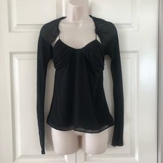 Chiffon Black Blouse With Pleated Brassiere. Attached Is A Mini Sleeve Garment. Chiffon Long Sleeve Tops For Night Out, Elegant Stretch Mesh Top For Party, Elegant Party Mesh Top With Stretch, Black Chiffon Tops For Spring, Chiffon Blouse For Night Out With Long Sleeves, Chic Stretch Chiffon Blouse, Elegant Mesh Top With Sheer Sleeves, Elegant Stretch Mesh Top For Layering, Spring Chiffon Tops For Night Out