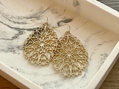 2.5 Inch Drop Earrings with Gold hooks. Painted matte gold Metal filigree. These have a gorgeous hue 😍 I would call them slightly oversize. Thank you for supporting American small business! Elegant Laser Cut Jewelry For Gifts, Laser Cut Metal Jewelry Gift, Elegant Laser Cut Jewelry As A Gift, Elegant Laser Cut Jewelry Gift, Gold Metal Chandelier Earrings With Filigree Detail, Gold Metal Filigree Chandelier Earrings, Gold Schmuck, Gold Hooks, Chunky Statement Necklace