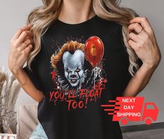 You'll Float Too T-shirt, Scary Movie Shirts, Horror Movie Shirt,Scary Clown Shirt, Halloween Shirt, Horror Movie Shirt, Halloween Gift * If the drop-down list says S-3XL, please add the size option to the customization note or send us a message. * If there is a color shown in the color chart but it is not in the drop-down list, please add it to the customization note. * If you have a different color and size preference, please send us a message. Unisex Short Sleeve Tee * 100% Airlume combed and Pop Culture Fan Merchandise Shirt For Halloween, Pop Culture Halloween Fan Merchandise Shirt, Halloween Pop Culture Fan Merchandise Shirt, Halloween Novelty Tops For Fans, Halloween Novelty Top For Fan Merchandise, Horror Themed Tops For Halloween, Halloween Horror Fan Merchandise Tops, Horror Style Halloween Fan Merchandise Tops, Novelty Halloween Fan Merchandise Top