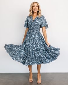 Blue-tiful blooms in this brand new pattern of the Spell Boho Midi Dress! 🌼💙 Shop this New Arrival now! 🛍️ Midi Dress With Ditsy Floral Print In Rayon, Flowy Smocked Dress With Ditsy Floral Print, Short Sleeve Dress With Elastic Neckline For Garden Party, Flowy Knee-length Smocked Dress With Floral Print, Blue Midi Dress With Gathered Neckline, Bohemian Rayon Dress With Smocked Bodice, Flowy Floral Sundress With Smocked Bodice, Bohemian Flowy Floral Dress With Smocked Bodice, Blue Dress For Garden Party With Gathered Neckline