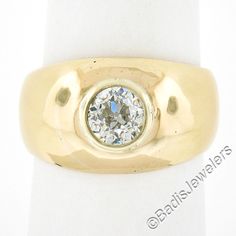 --Stone(s):-- (1) Natural Genuine Diamond - Old European Cut - Bezel Set - L/M Color - SI2 Clarity Total Carat Weight: 1.02 (exact) Material: Solid 18k Yellow Gold  Weight: 12.87 Grams Ring Size: 7.5 (Fitted on a finger. We can custom size this ring - please contact us prior to purchase for sizing inquires) Ring Width: 12.1mm (0.47") (top of the ring - north to south) - 4.3mm (bottom of the shank) Ring Height: 5.2mm rise off the finger Condition: Excellent condition! Stock Number: MK-440193534-2 Classic Jewelry With Bezel Setting And Wide Band, Yellow Gold Solitaire Jewelry With Wide Band, Yellow Gold Wide Band Jewelry With Bezel Setting, Yellow Gold Jewelry With Bezel Setting In Wide Band, Formal Jewelry With Bezel Setting And Wide Band, Formal Wide Band Jewelry With Bezel Setting, Fine Jewelry Wide Band With Single Diamond, Fine Jewelry Single Diamond Wide Band, Fine Jewelry With Single Diamond Wide Band