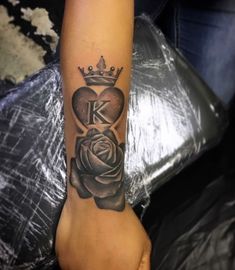 a woman's arm with a tattoo on it and a rose in the middle