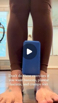 a person standing on top of a wooden floor next to a blue object with words written below it