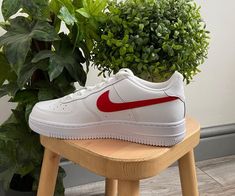 Upgrade your sneaker game with the stylish and iconic Red Heart Custom Air Force 1s. Featuring a pristine white leather upper paired with tonal red swoosh and heart detailing, these shoes are sure to draw attention to your footwear collection. With a foam sole for comfort and Nike cushioning, these shoes are as comfortable as they are stylish. iends, family, that special someone, or yourself ✨ - Exactly as shown in the pictures. - Brand New & Authentic. 💯 - Hand Painted with attention to detail. 👨‍🎨 - Waterproof and Flexible. ❤️ - Unisex model. Please refer to the Size Chart. - Free Worldwide Shipping. ✈︎ White Nike Air Force 1 With Contrast Sole, Nike Air Force 1 White With Contrast Sole, Casual Nike Air Force 1 With Contrast Sole, White High-top Nike Air Force 1 With Contrast Sole, Casual Nike Air Force 1 White With Contrast Sole, Modern White Nike Air Force 1 With Round Toe, Nike Air Force 1 White Leather With Contrast Sole, White Leather Nike Air Force 1 With Contrast Sole, Nike Air Force 1 With Red Sole