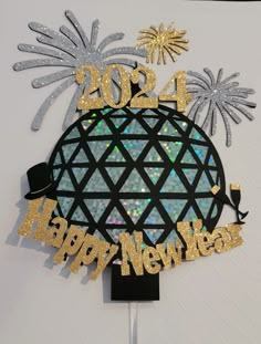 a happy new year's card with fireworks and a stylized globe on the front