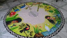 a round table with an artistic painting on it