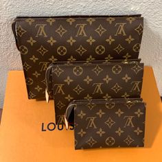 Louis Vuitton Monogram Toiletry Pouch Full Set. Authentic Brand New Tp 26 Tp 19 Tp 15. The Larger One Is The Oldest Of The Three. Comes With Tags, Dust Bags, Lv Box, Receipt Copies. No Low Ballers Or Price Discussions In The Comments. The Tp 26 Has Some Light Patina On The Zipper And Includes A Felt Insert For Credit Cards The Others Do Not. No Longer Sold In Stores. Beautiful Condition Coming From A Reputable Seller Posh Will Authenticate As Well. Can Be Sold Separately. Louis Vuitton Luggage Tag, Louis Vuitton Neverfull Damier, Louise Vuitton, Palm Springs Mini Backpack, Louis Vuitton Felicie, Louis Vuitton Agenda, Louis Vuitton Luggage, Louis Vuitton Sarah Wallet, Louis Vuitton Capucines