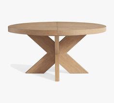 a round wooden table with two crossed legs and an x design on the top, against a white background