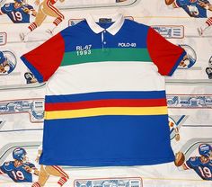 Vintage Polo Ralph Lauren RL-67 1993 Polo-93 Lifesaver Polo Shirt Size XXL Great Pre Owned Conditions Size  XXL As Per on Tag but u can check the Measurements before buying. Measurements: Pit To Pit - 26 Inches Collar To Bottom - 31 Inches 100% Authentic. Awesome Condition. No Stains or Holes Made in Vietnam 100% Cotton Condition is a matter of opinion. Review all photos closely. Make your own determination as to color, style and condition of the item. Note: For International shipping for USA / Retro Graphic Print Polo Collar Tops, Multicolor Polo Collar Top With Graphic Print, Retro Multicolor Sports Tops, Multicolor Graphic Print Polo Collar Top, Multicolor Retro Sports Tops, Multicolor Graphic Print Top With Polo Collar, Multicolor Graphic Print Short Sleeve Polo Shirt, Vintage Polo Ralph Lauren, Vintage Polo