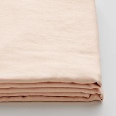 the linen is folded neatly on top of each other