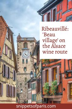 an image of a street with buildings and a clock tower in the background that reads rueauvillee village on the alsace wine route