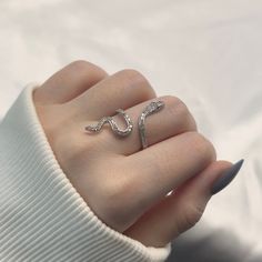 Introducing the Sparkly Snake Adjustable Ring - an alluring piece crafted from s925 sterling silver. This captivating ring features a sleek snake design adorned with sparkling accents, adding a touch of mystique and elegance. Its adjustable band ensures a perfect and comfortable fit for any finger. The Sparkly Snake Adjustable Ring is a stunning addition to any jewelry collection, embodying both charm and sophistication. Snake Accessories Jewelry, Silver Snake Jewelry, Snake Rings Aesthetic, Snake Jewelry Necklaces, Snakes Jewelry, Snake Jewelry Ring, Snake Accessories, White Masquerade Mask, White Masquerade