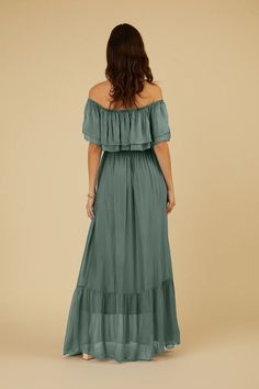 Experience the epitome of vacation elegance with the Laurie Dress, ideal for a sun-soaked escape to the south of Spain or a romantic getaway in Mexico. This long and flowy dress features a beautiful, off-the-shoulder ruffled neckline. This dress exudes pure fabulousness, ensuring you look stunning no matter how you style it. Crafted from luxurious Italian silk, the Laurie Dress is a glamorous choice and perfectly worn as a bridesmaid dress during the wedding season. The Laurie dress is designed Flowy Maxi Dress For Brunch Vacation, Chic Off Shoulder Maxi Dress For Vacation, Elegant Strapless Off Shoulder Beach Dress, Breezy Maxi Dress For Vacation Brunch, Elegant Off Shoulder Beach Dress For Summer, Elegant Off-shoulder Summer Beach Dress, Elegant Off Shoulder Dress For Summer Beach, Elegant Off-shoulder Dress For Summer Beach, Summer Off-shoulder Maxi Dress For Beach Season