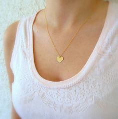 "A Minimalist handmade gold-filled or sterling silver necklace with a tiny heart charm, layered pendant necklace. This necklace is made from high-quality 14K gold filled. Unlike gold plating, the gold in gold-filled jewelry is mechanically bonded to the base metal, and it will not wear off or turn black. It is light and classic, perfect for everyday use. You can wear it as a single, minimalist necklace or layered with more necklaces for a total boho look. Get this basic necklace - you just can't Dainty Heart Initial Pendant Necklace For Everyday, Dainty Heart Pendant Charm Necklace For Everyday, Dainty Everyday Heart Pendant Charm Necklace, Simple Heart Pendant Necklace For Everyday, Minimalist 14k Gold Filled Necklaces With Heart Charm, Minimalist 14k Gold-filled Necklace With Heart Charm, Minimalist 14k Gold Filled Necklace With Heart Charm, Dainty Everyday Necklace With Heart Charm, Delicate Heart Pendant Charm Necklaces