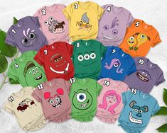 children's t - shirts with cartoon faces on them and numbers in the middle