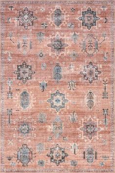 an orange and blue rug with many different designs on the front, in various colors